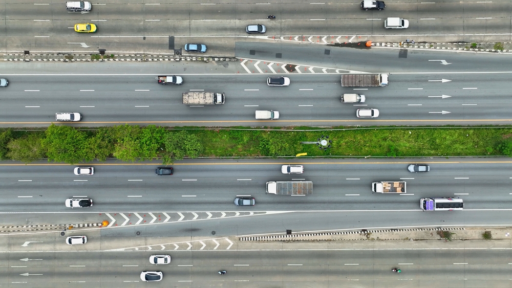 Aerial view of heavy freeway traffic where lane splitting by motorcycles may occur in California