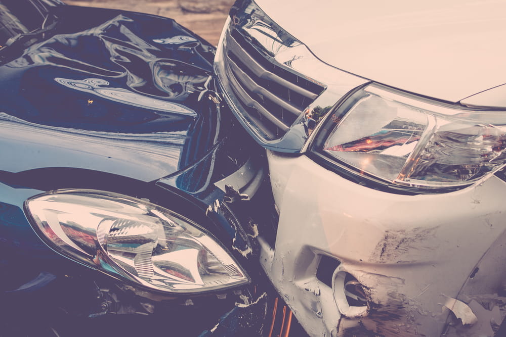 Two damaged vehicles after a rideshare passenger accident in California