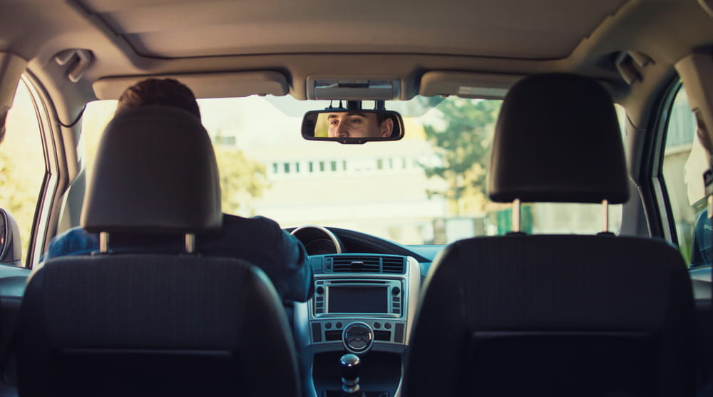Passenger perspective inside a rideshare vehicle involved in a California Uber or Lyft accident