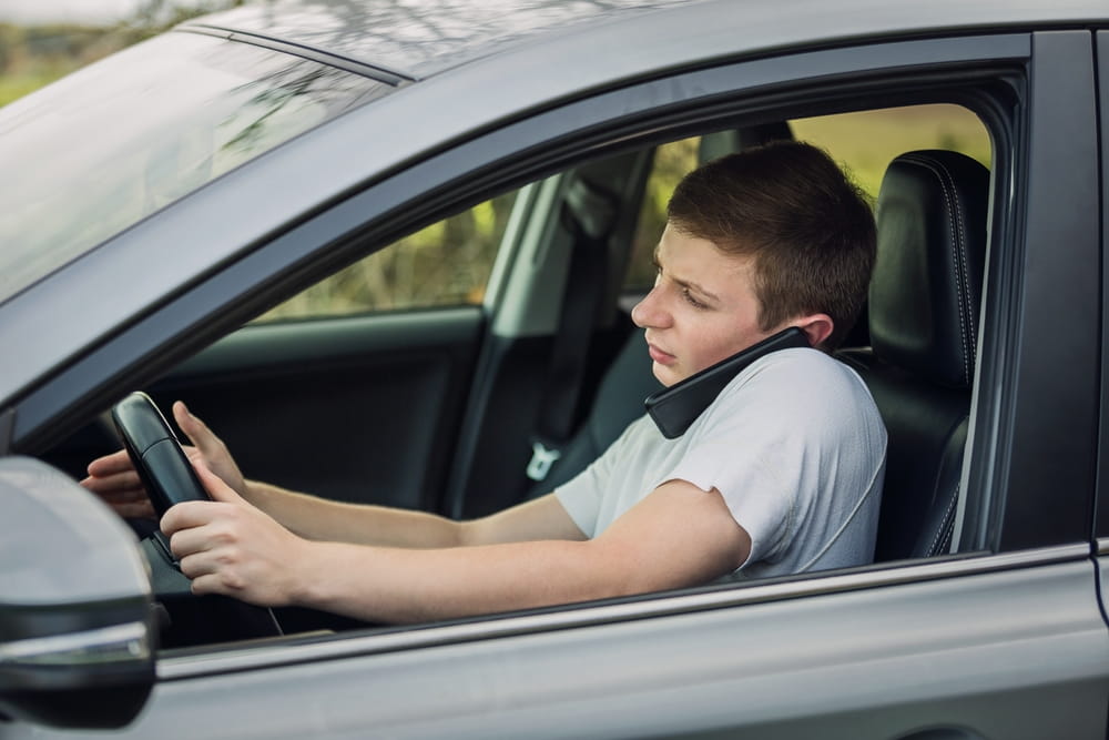 Driver using a phone while operating a vehicle